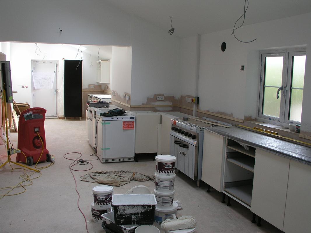 Work in progress on the kitchen installation.